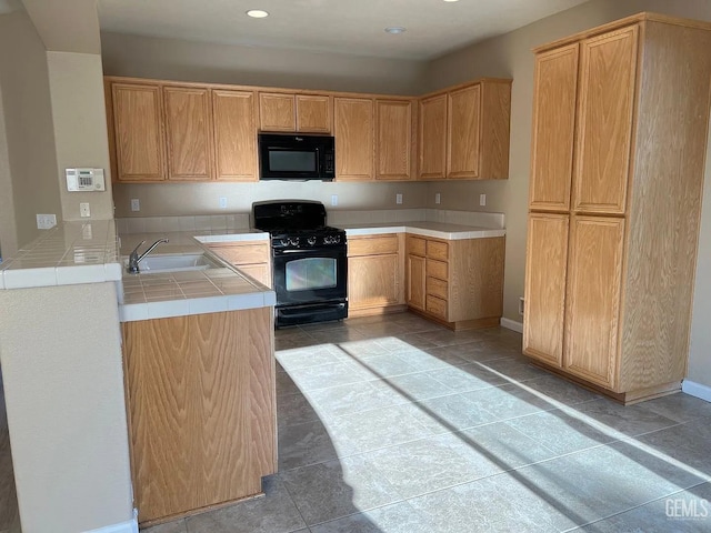 5413 Ridgecrest Ct, Bakersfield, CA 93313 - kitchen with black appliances, tile counters, recessed lighting, and light tile patterned flooring