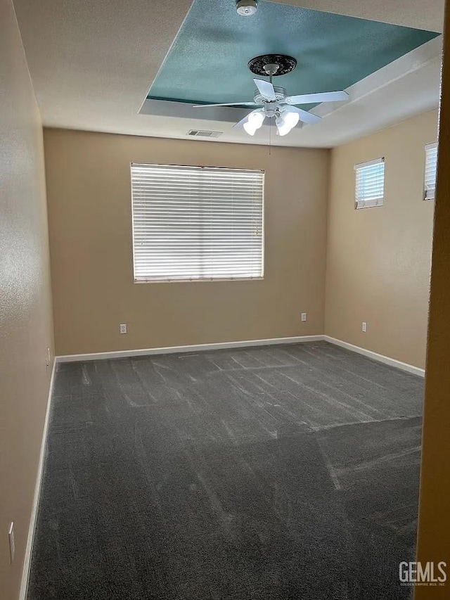 5413 Ridgecrest Ct, Bakersfield, CA 93313 - unfurnished room featuring ceiling fan, carpet floors, a smoke detector, and a raised ceiling
