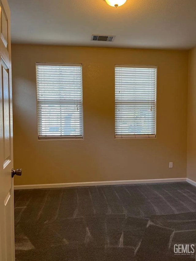 5413 Ridgecrest Ct, Bakersfield, CA 93313 - spare room with dark colored carpet and plenty of natural light