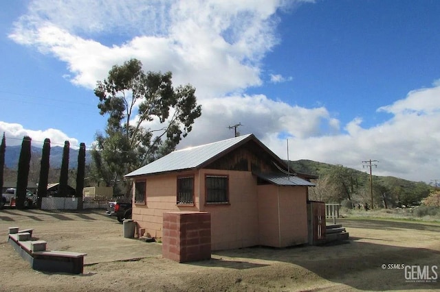 3990 Erskine Creek Rd, Lake Isabella, CA 93240 - view of property exterior featuring a metal roof and concrete block siding