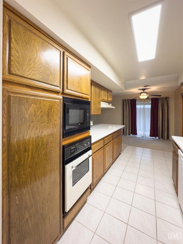 kitchen featuring white appliances and light tile patterned floors