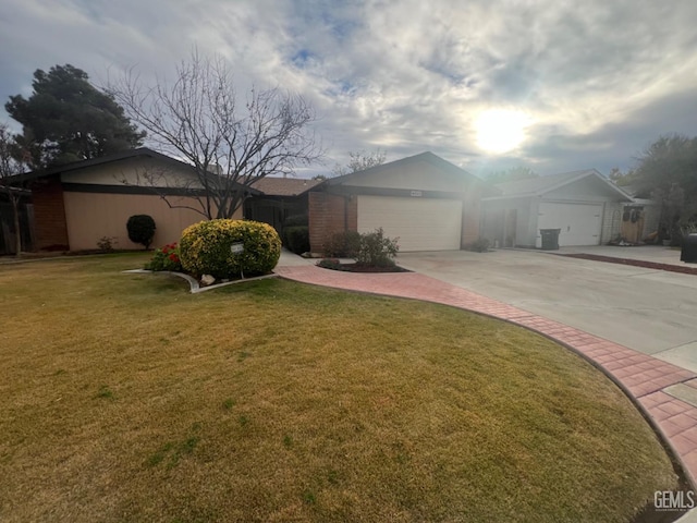 single story home with a front lawn and a garage