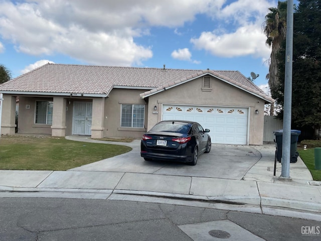 single story home with a front lawn and a garage