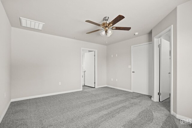 601 Poinsettia St, Bakersfield, CA 93307 - unfurnished bedroom with baseboards, carpet flooring, and visible vents