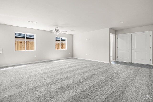 601 Poinsettia St, Bakersfield, CA 93307 - empty room with carpet floors, a ceiling fan, baseboards, and visible vents