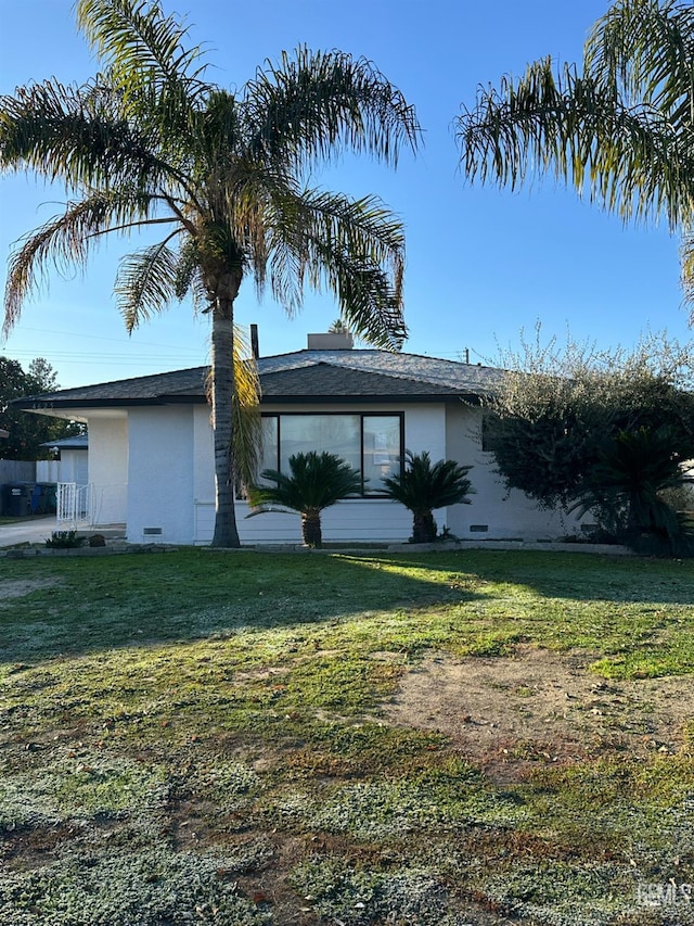 view of property exterior featuring a yard