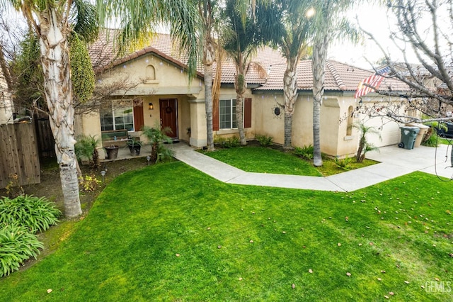 view of front of property with a garage and a front yard