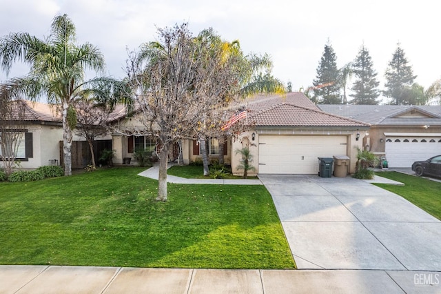 view of front of property with a garage and a front yard