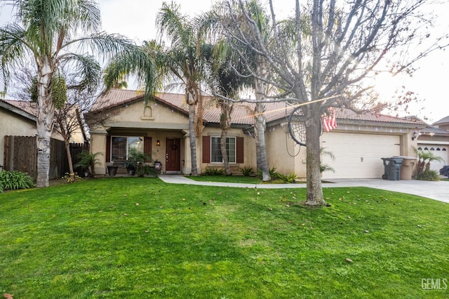 mediterranean / spanish home with a front yard and a garage