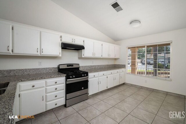 3502 Southpass Dr, Bakersfield, CA 93312 - kitchen with stainless steel gas range oven, under cabinet range hood, lofted ceiling, light tile patterned floors, and white cabinets