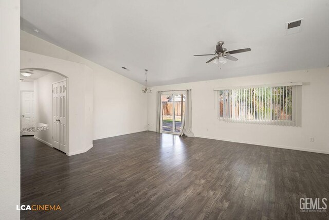 3502 Southpass Dr, Bakersfield, CA 93312 - unfurnished room with ceiling fan, dark wood-style flooring, vaulted ceiling, arched walkways, and a chandelier