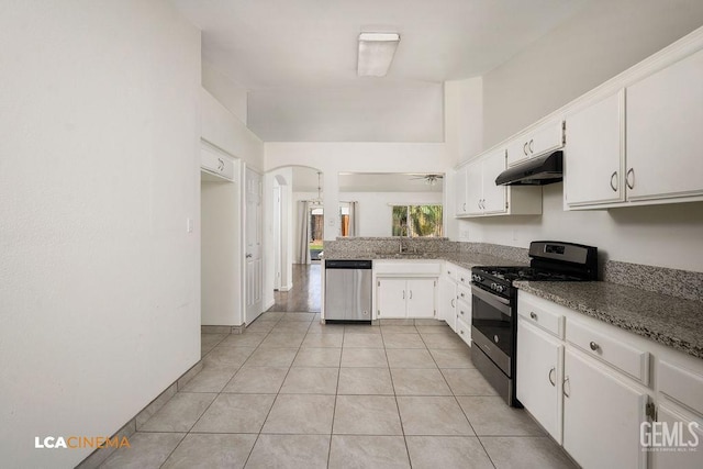 3502 Southpass Dr, Bakersfield, CA 93312 - kitchen with stainless steel appliances, under cabinet range hood, white cabinetry, arched walkways, and a peninsula