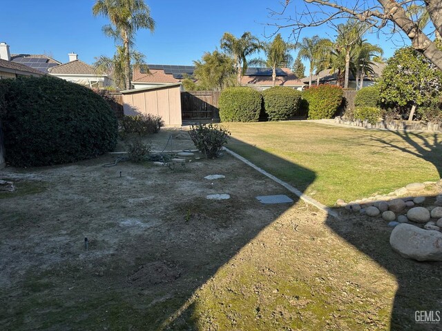 back of house featuring a yard