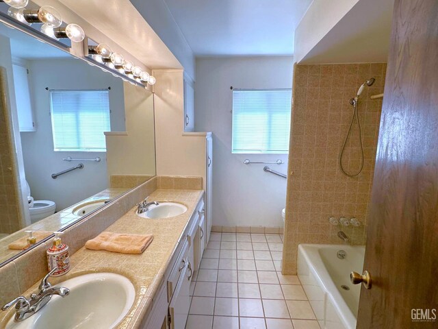 bathroom with tile patterned flooring and vanity