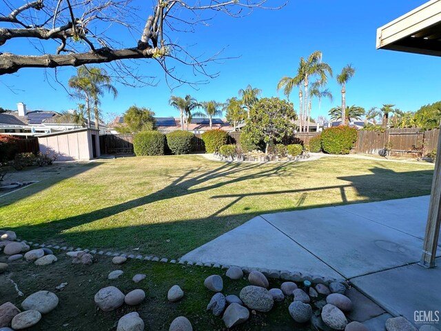 back of house with a lawn