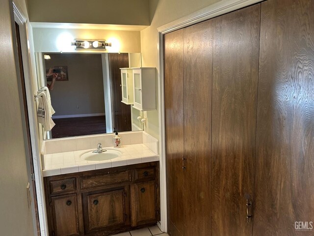 hallway with a textured ceiling and dark colored carpet