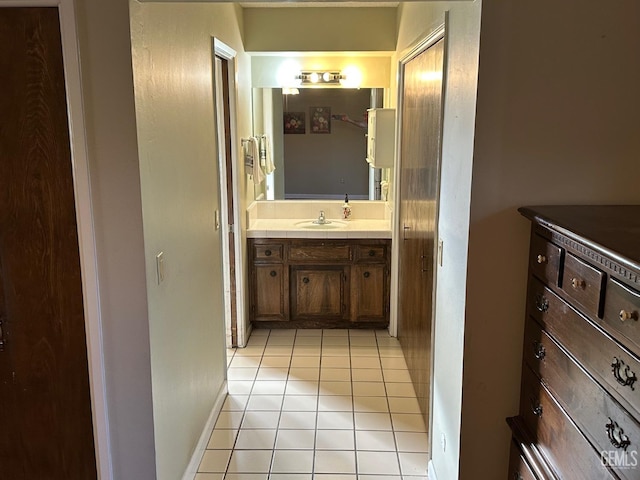 bathroom featuring tile patterned flooring and vanity