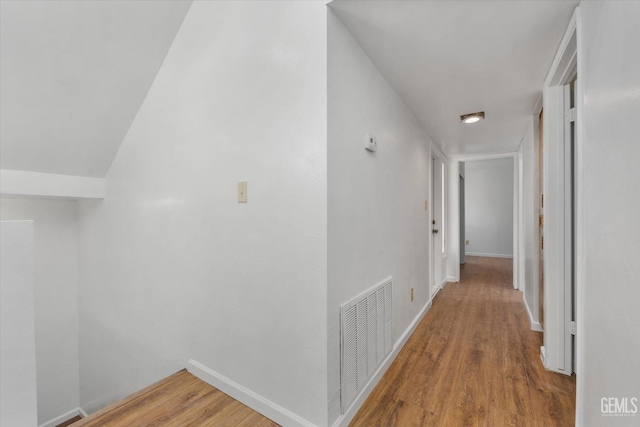 corridor featuring hardwood / wood-style floors