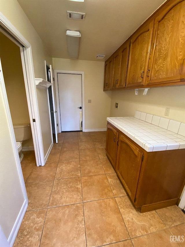 1912 Mountain Oak Rd, Bakersfield, CA 93311 - corridor with baseboards and light tile patterned floors