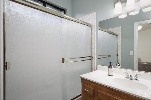 full bath featuring a stall shower and vanity