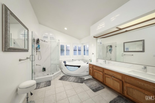 full bathroom with a garden tub, a sink, vaulted ceiling, double vanity, and a stall shower