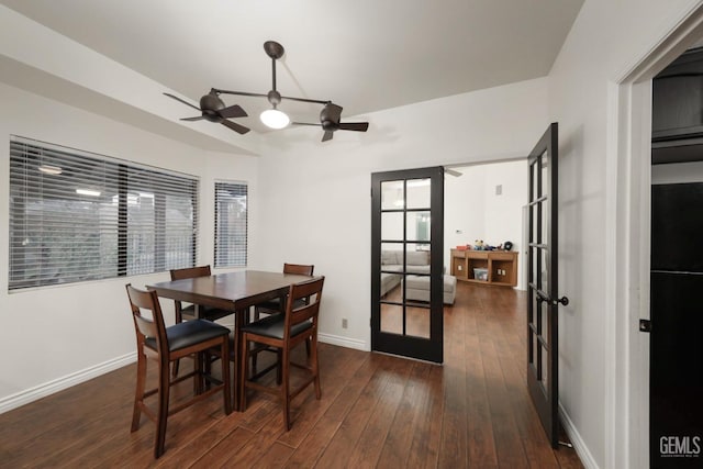 dining room featuring dark wood-style floors, french doors, ceiling fan, and baseboards