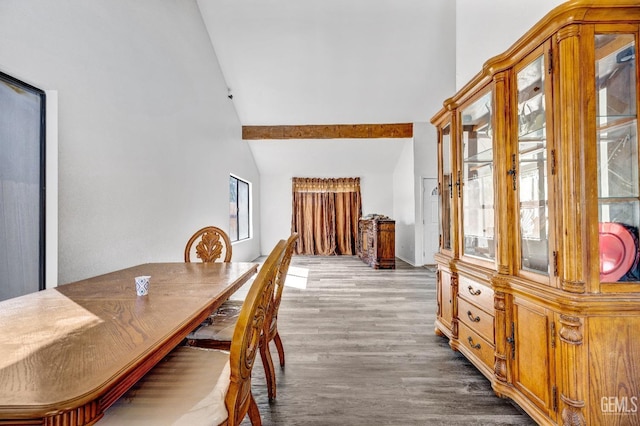 dining space featuring high vaulted ceiling, beamed ceiling, and wood finished floors