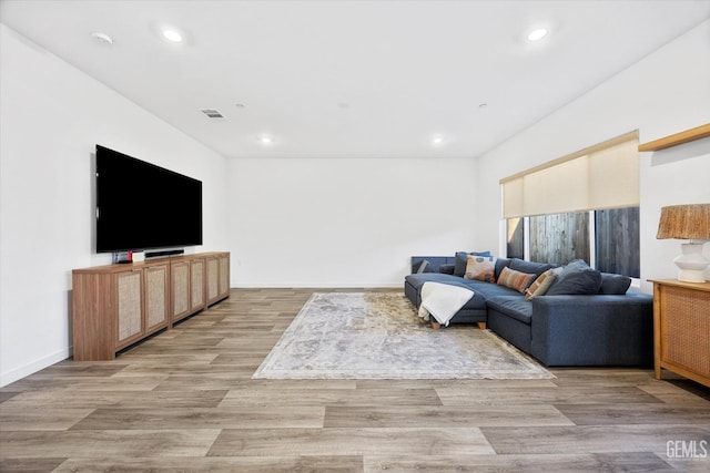 living room with light hardwood / wood-style flooring