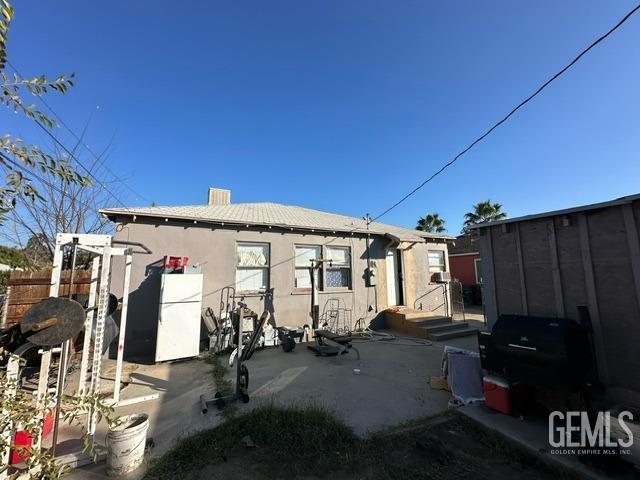 rear view of property with a patio