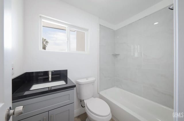 bathroom featuring toilet, shower / tub combination, and vanity