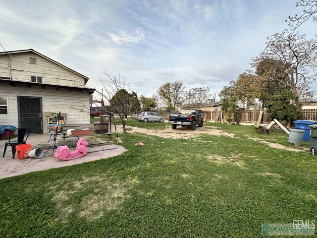 view of yard with a patio and fence