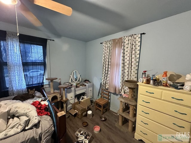 bedroom featuring a ceiling fan and wood finished floors