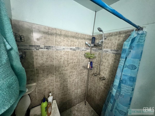bathroom with a shower stall
