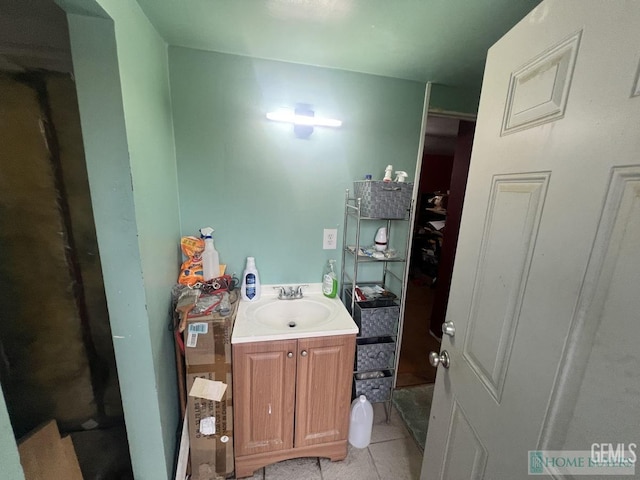 bathroom with tile patterned flooring and vanity