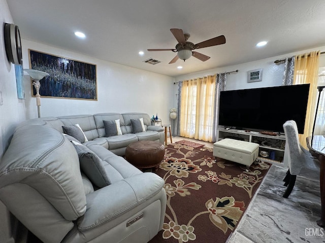 living room with carpet floors, recessed lighting, visible vents, and a ceiling fan