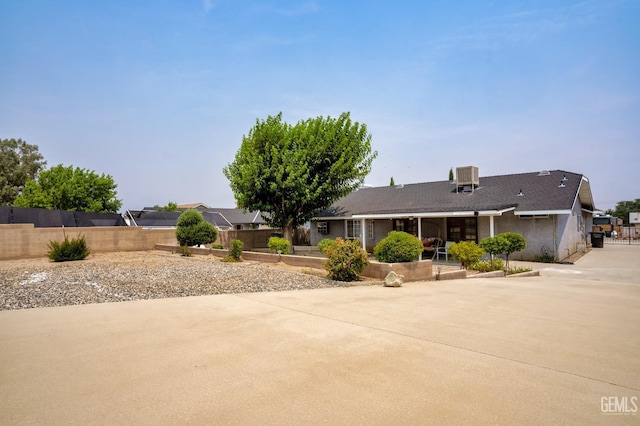 single story home featuring central AC, a patio, and fence