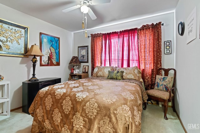 bedroom featuring carpet floors, ceiling fan, and baseboards