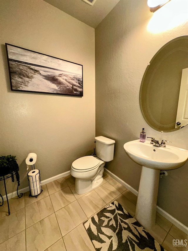 15209 Aldridge Ave, Bakersfield, CA 93314 - bathroom with tile patterned flooring, toilet, and a sink