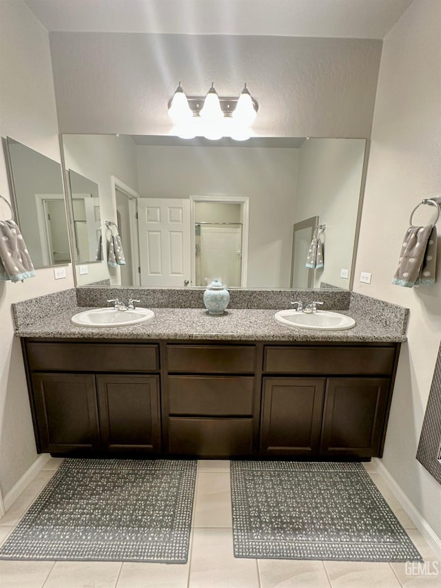 15209 Aldridge Ave, Bakersfield, CA 93314 - full bath featuring tile patterned floors and double vanity