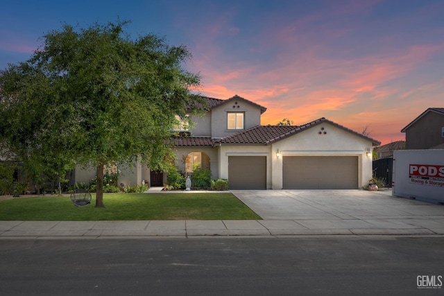 16009 La Strada Ct, Bakersfield, CA 93314 - mediterranean / spanish-style house with stucco siding, a garage, a front yard, concrete driveway, and a tiled roof