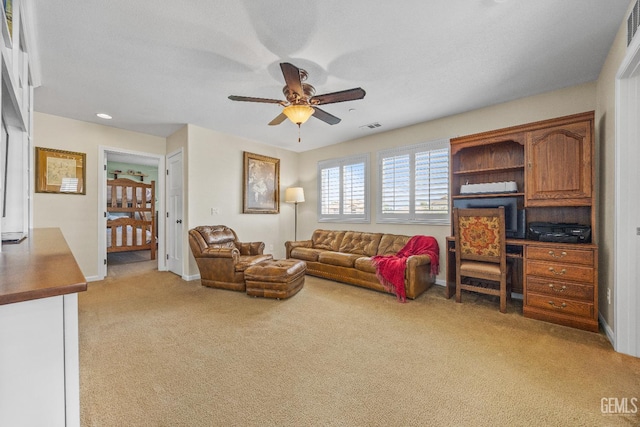 16009 La Strada Ct, Bakersfield, CA 93314 - living area with light colored carpet, ceiling fan, and baseboards