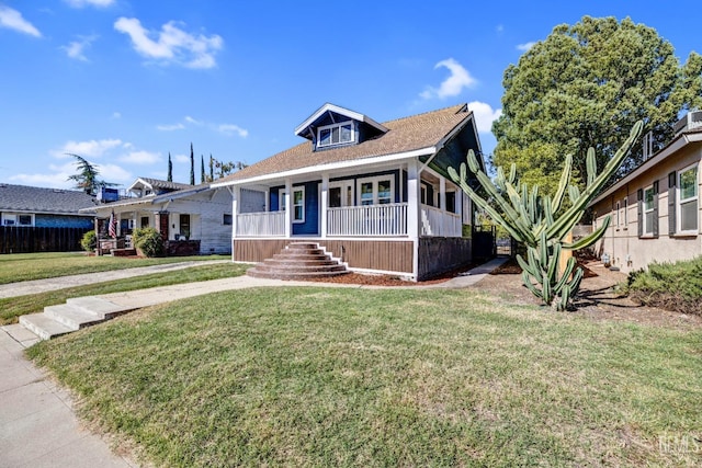 view of front facade featuring a porch and a front lawn