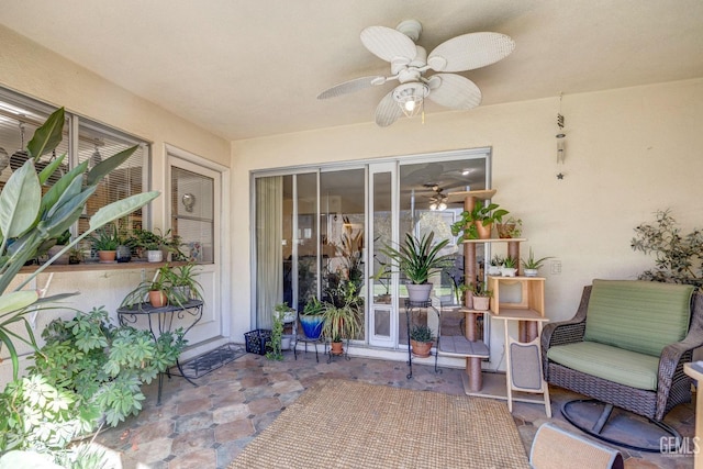 property entrance featuring ceiling fan and a patio area