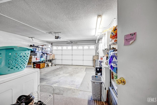 garage with washer / dryer and a garage door opener