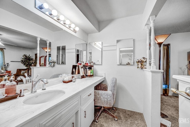 bathroom featuring ceiling fan and vanity