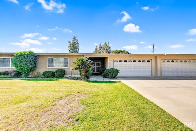 single story home with a garage and a front lawn