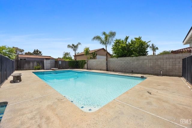 view of pool with a patio, a fenced in pool, and a fenced backyard