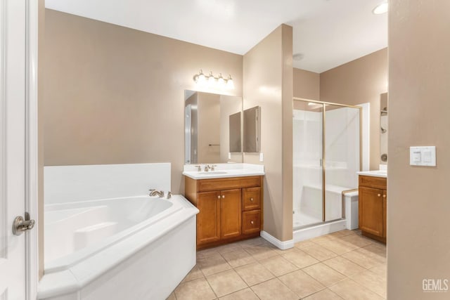 bathroom with tile patterned floors, plus walk in shower, and vanity