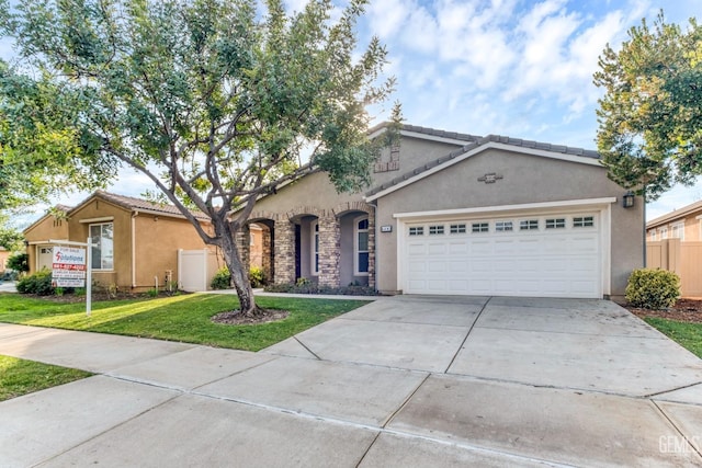 ranch-style house featuring a garage and a front lawn