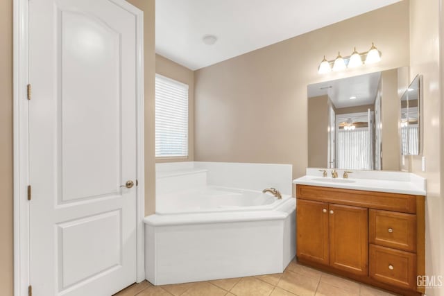 bathroom featuring tile patterned flooring, vanity, and a bathtub